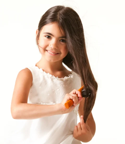 Home cute girl in white dress combing brown hair scaled e1766338772864